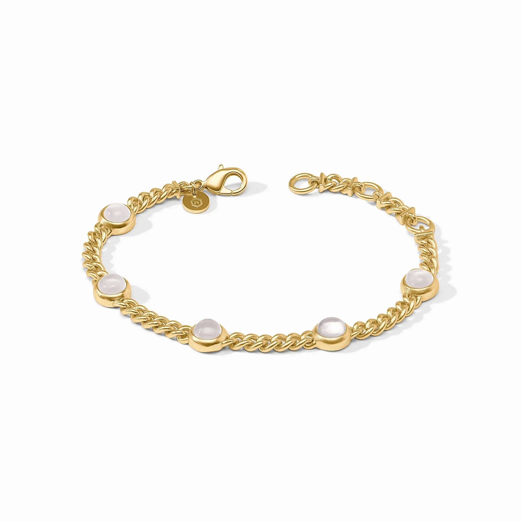 Gold bracelet with pearls on a white background