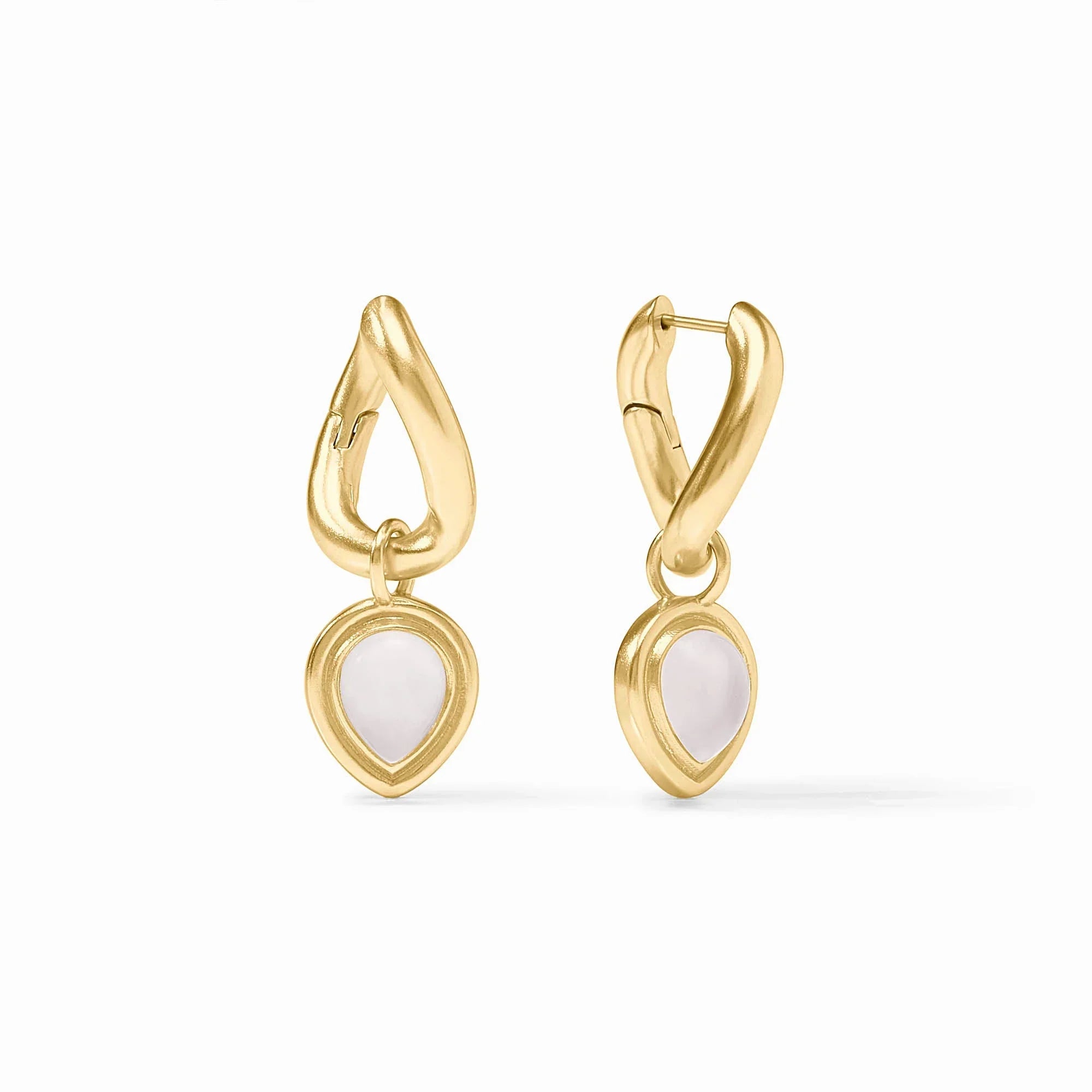Gold earrings with white stones on a white background