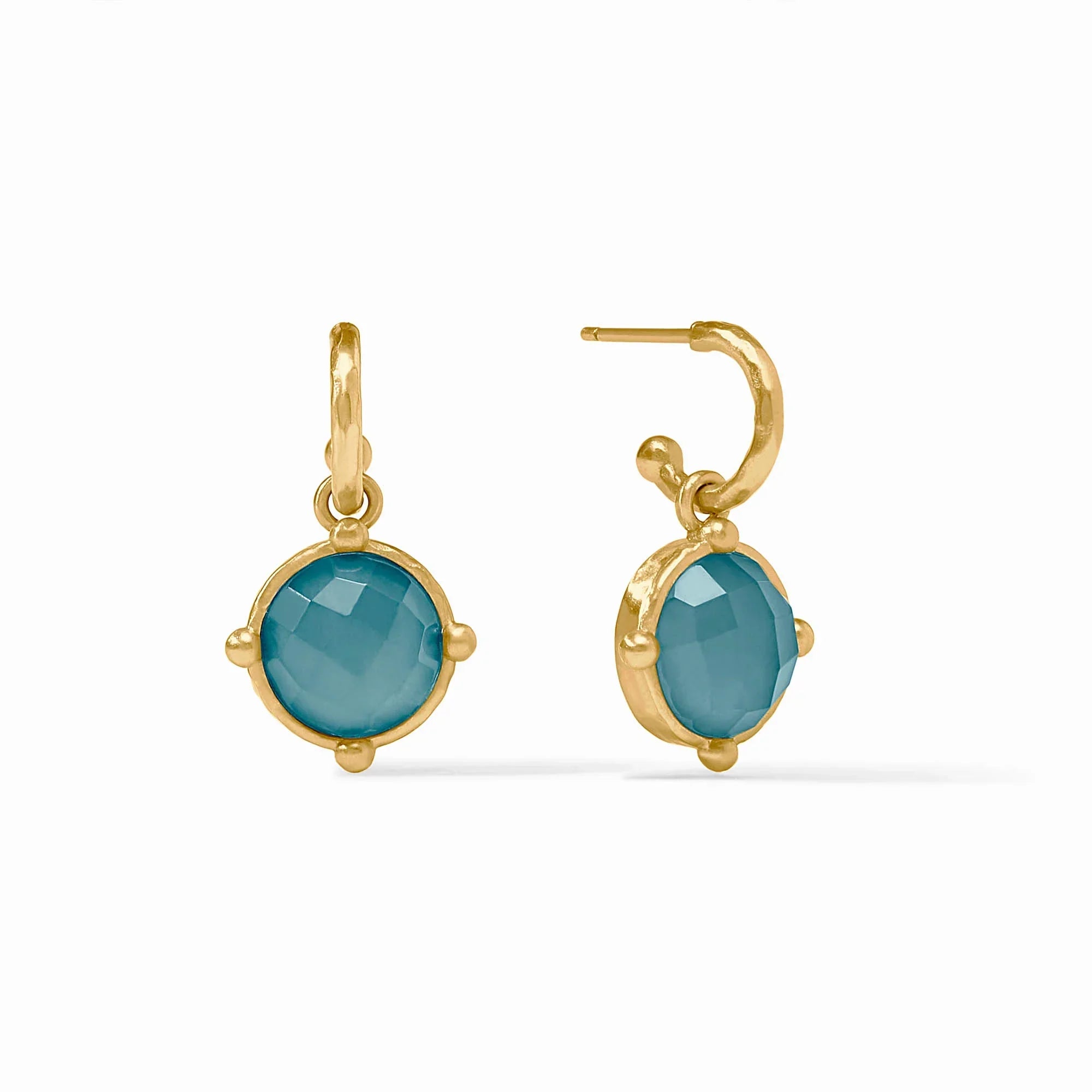 Gold earrings with teal stones on a white background