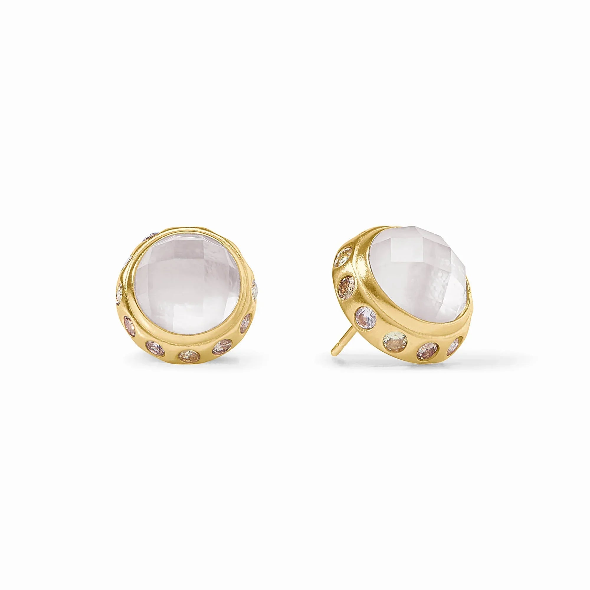 Gold earrings with clear gemstones on a white background