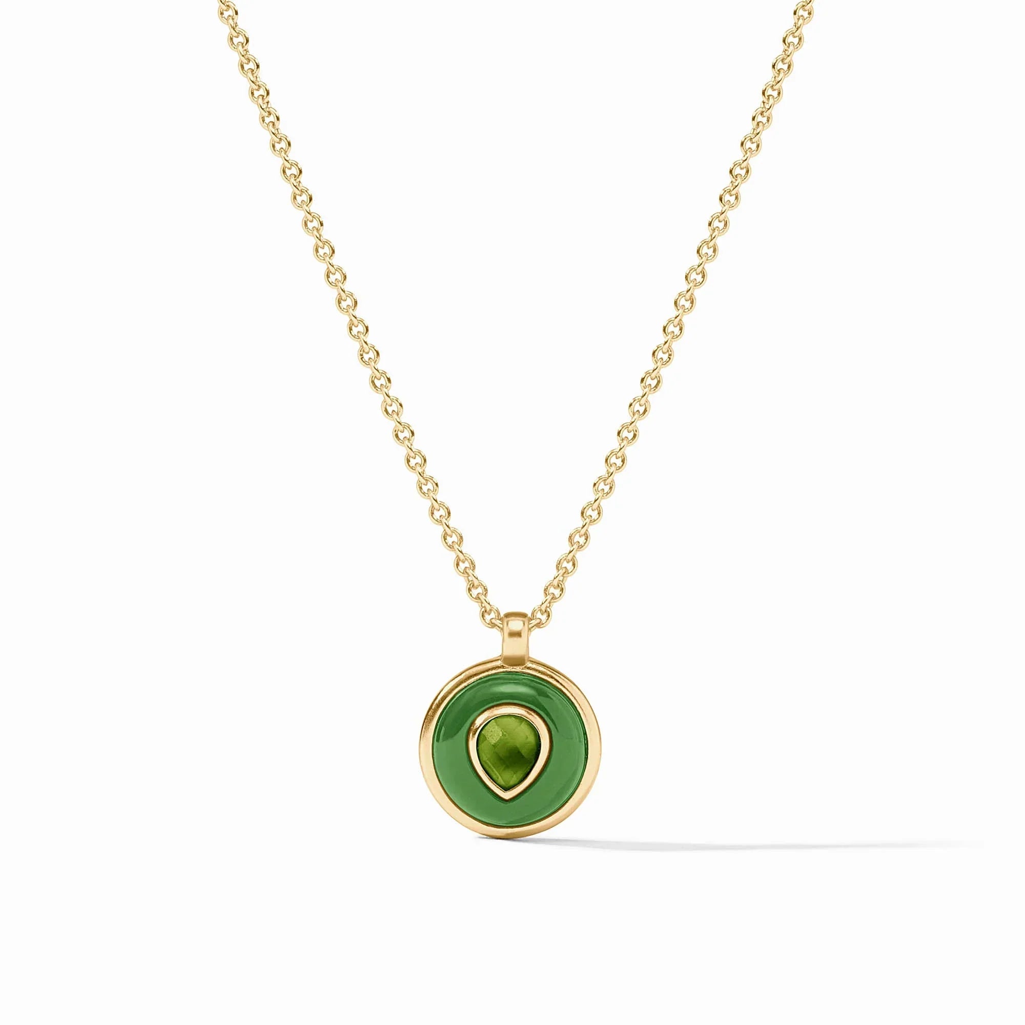Gold necklace with a green pendant on a white background
