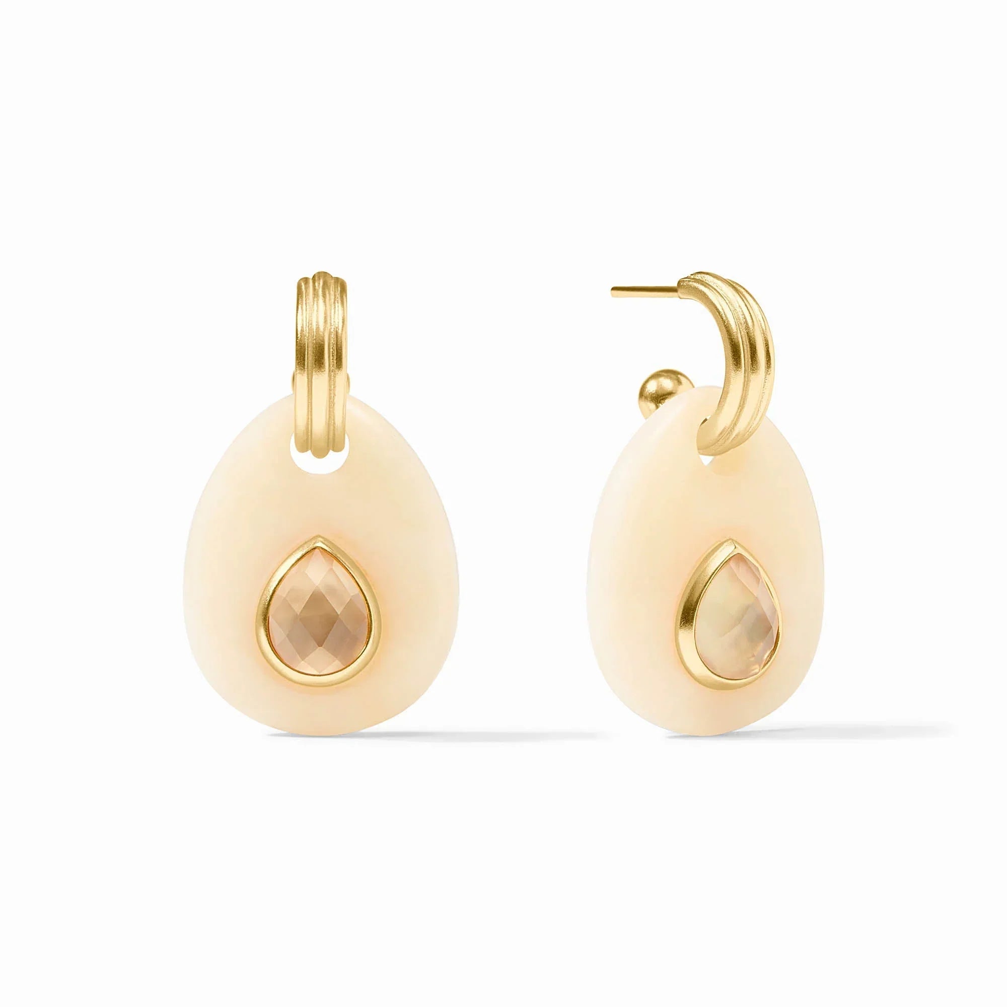 Pair of gold earrings with teardrop-shaped stones on a white background