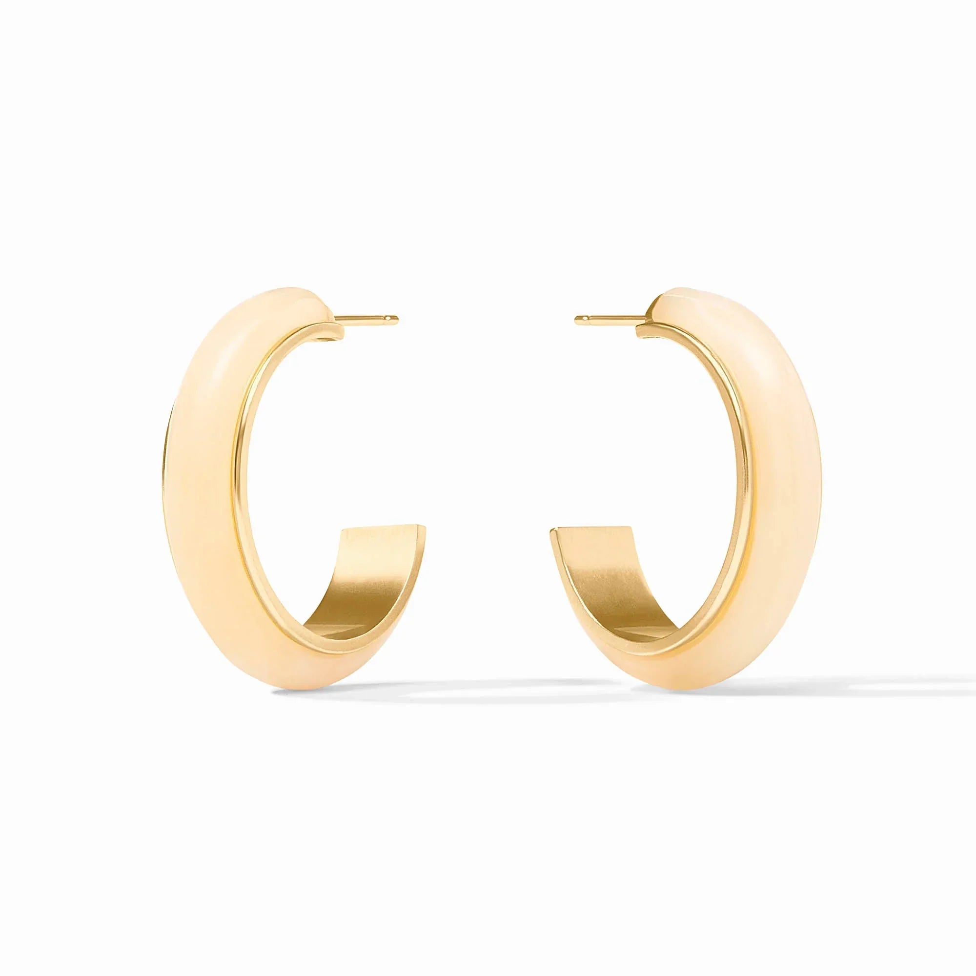 Gold hoop earrings on a white background