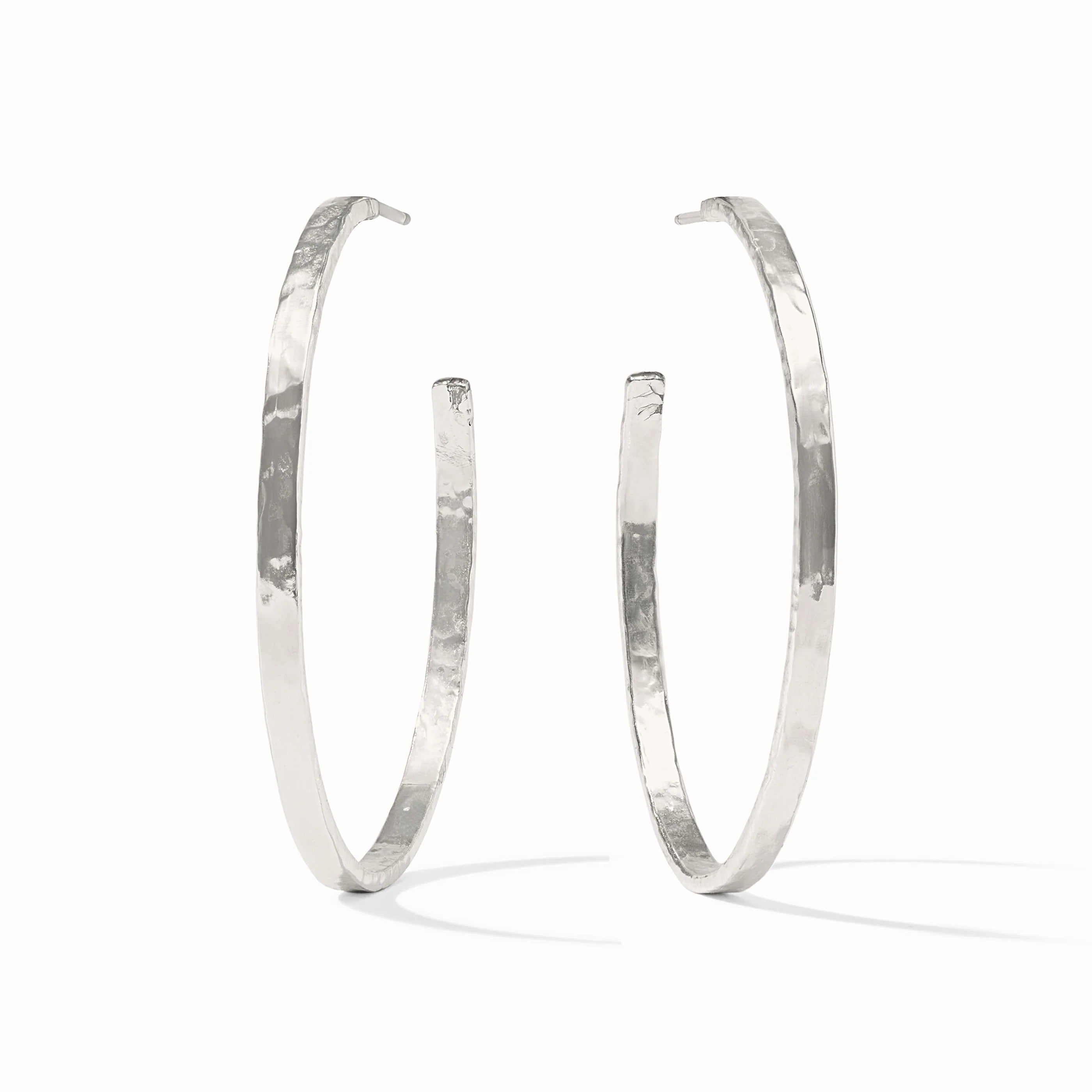 Pair of silver hoop earrings on a white background