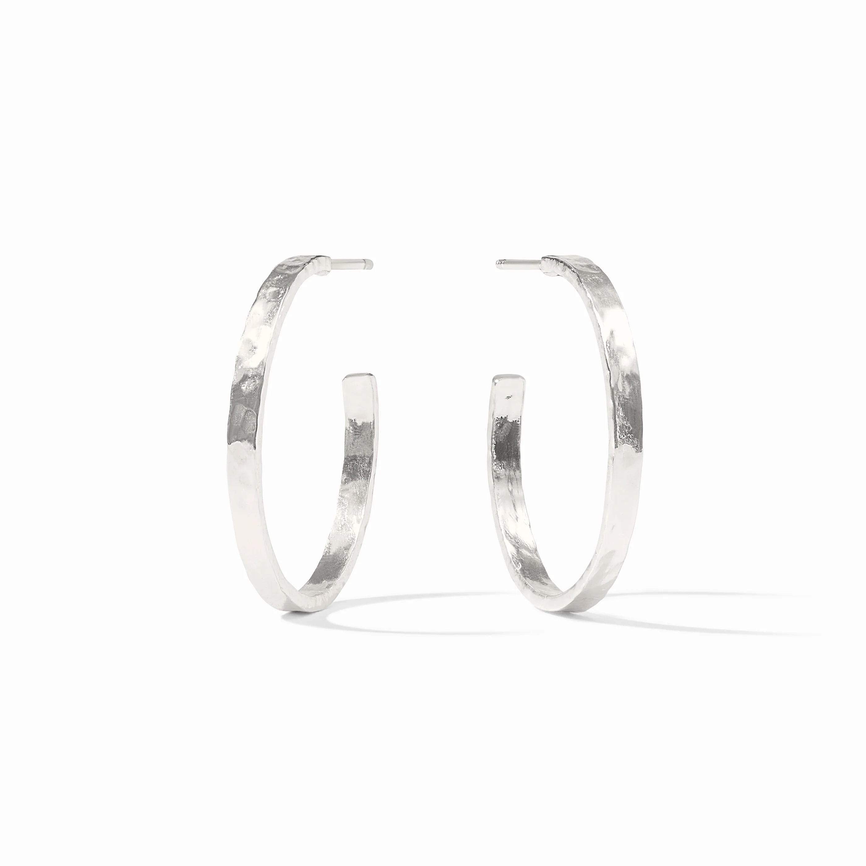 Pair of silver hoop earrings on a white background