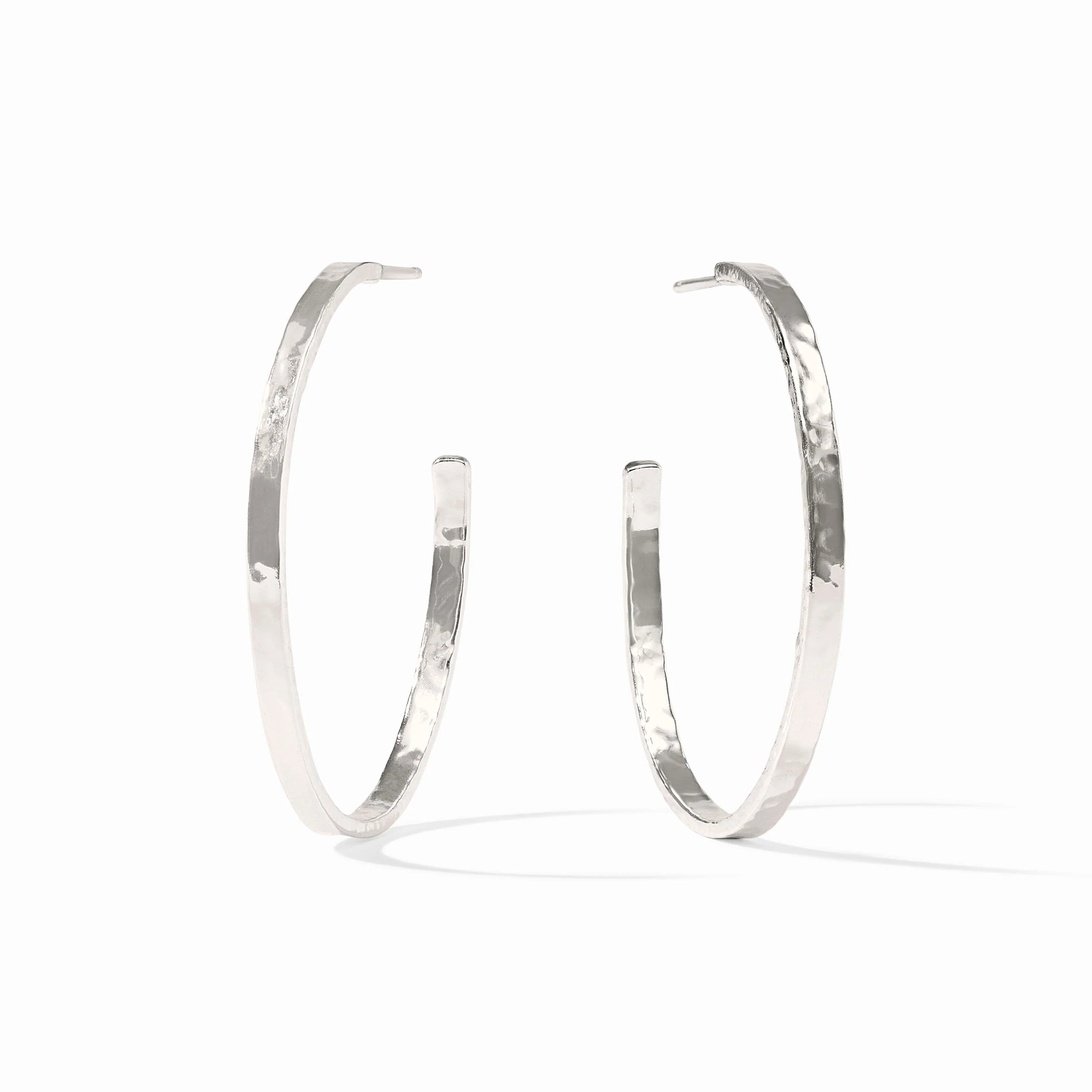Pair of silver hoop earrings on a white background