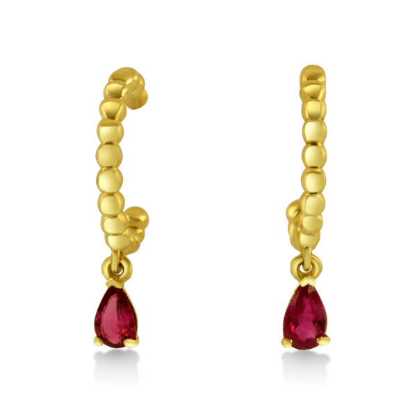 Gold hoop earrings with red gemstones on a white background