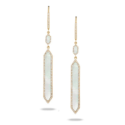 Pair of gold earrings with gemstones on a white background