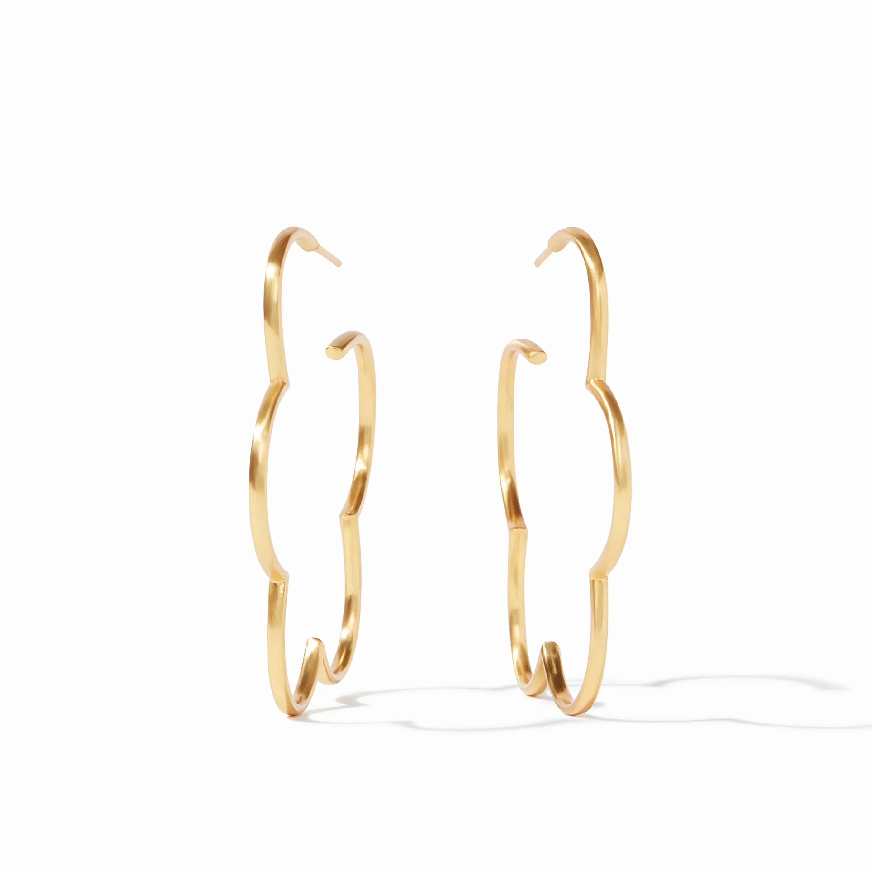 Gold hoop earrings on a white background