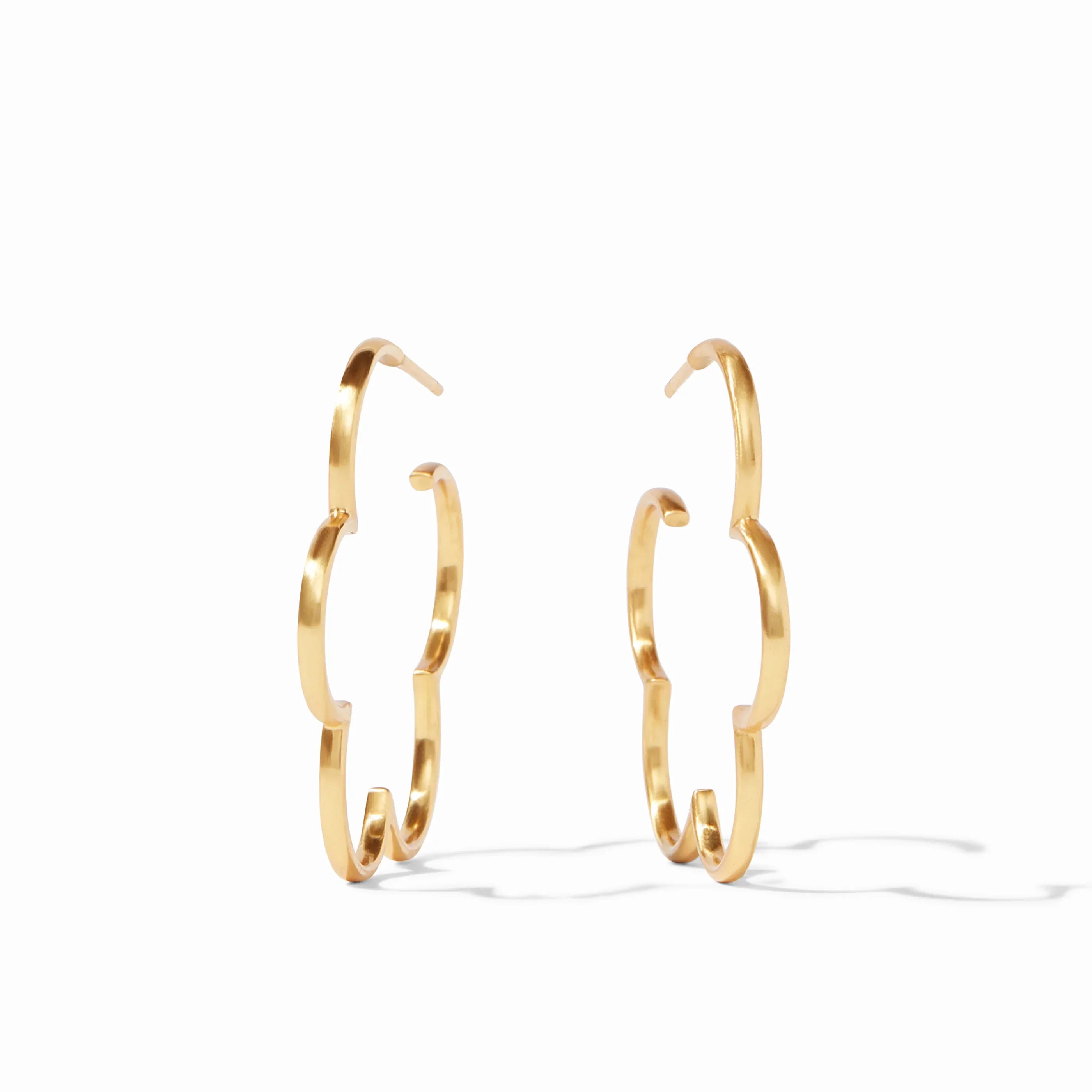Gold hoop earrings on a white background
