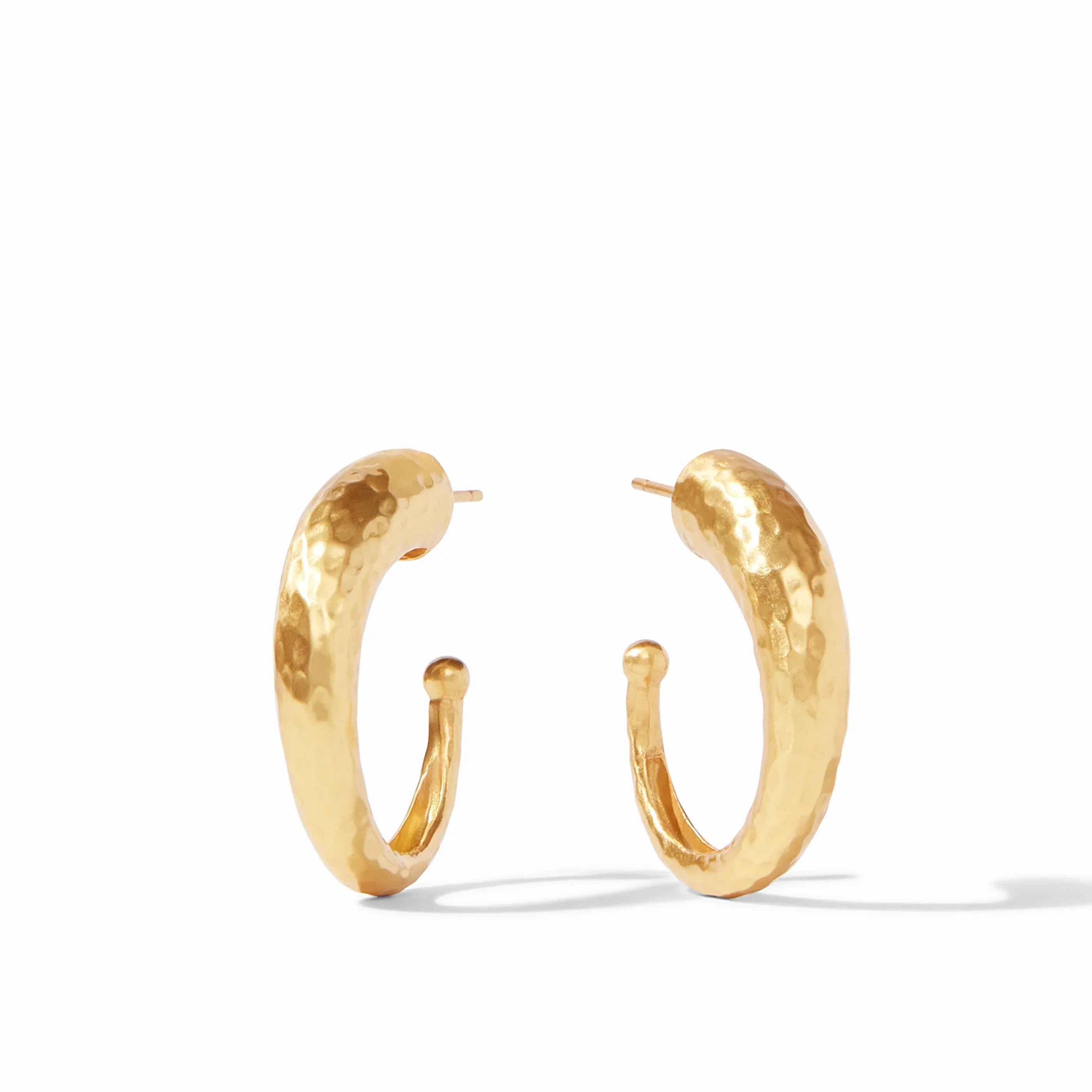 Gold hoop earrings on a white background