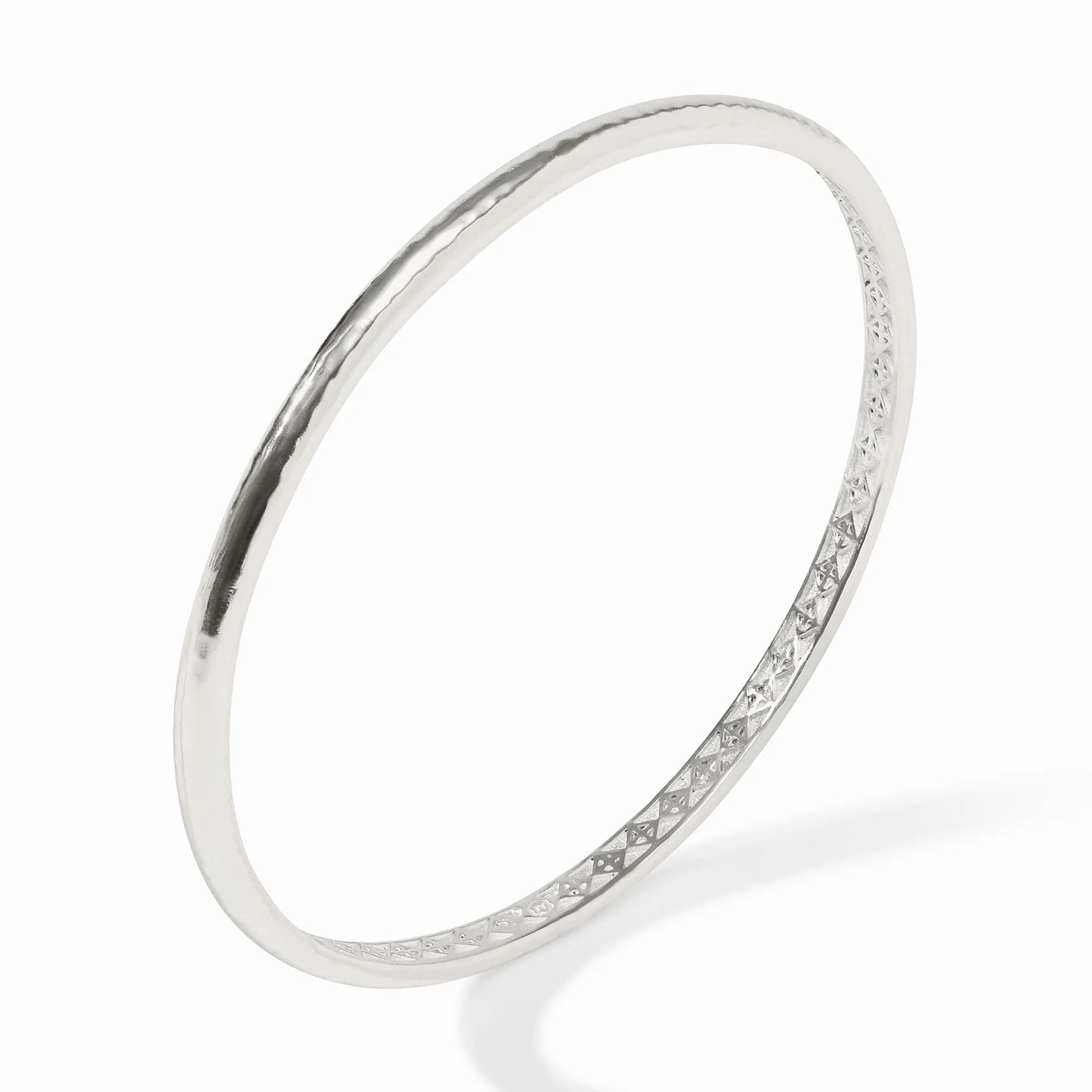 Silver bangle on a white background