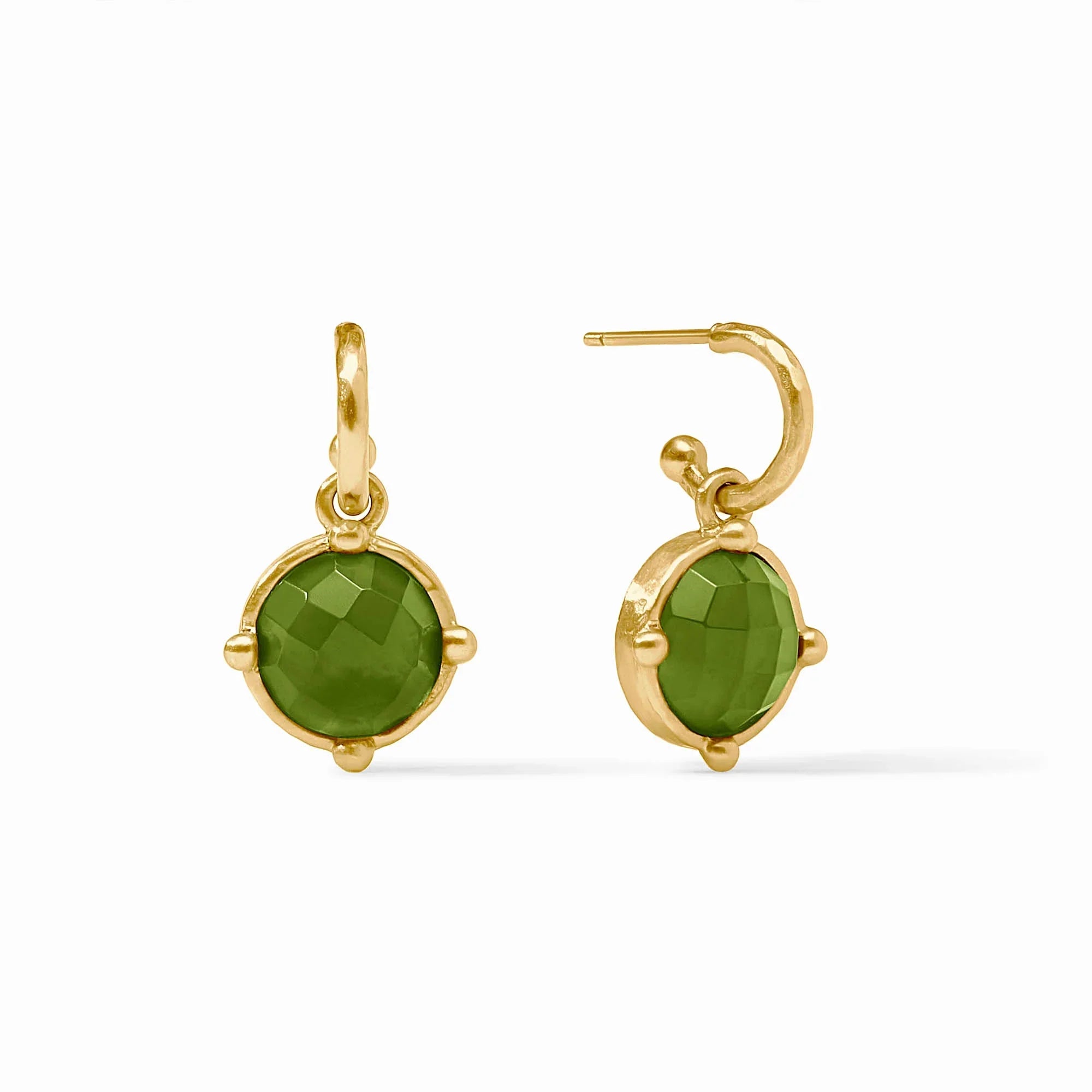Gold earrings with green gemstones on a white background