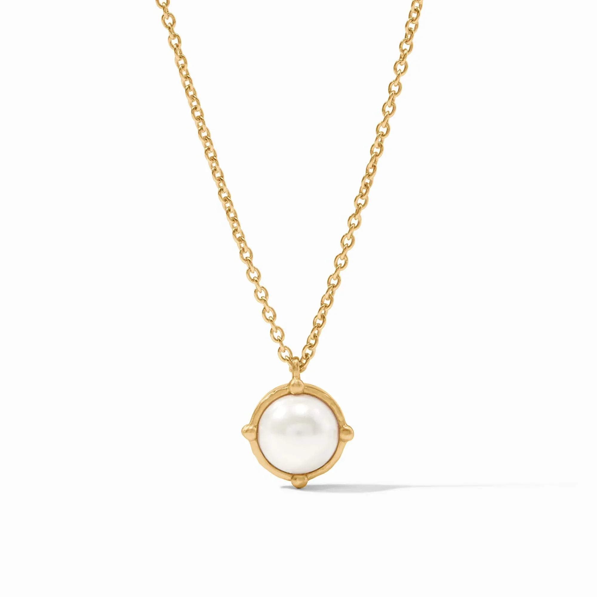 Gold necklace with a pearl pendant on a white background