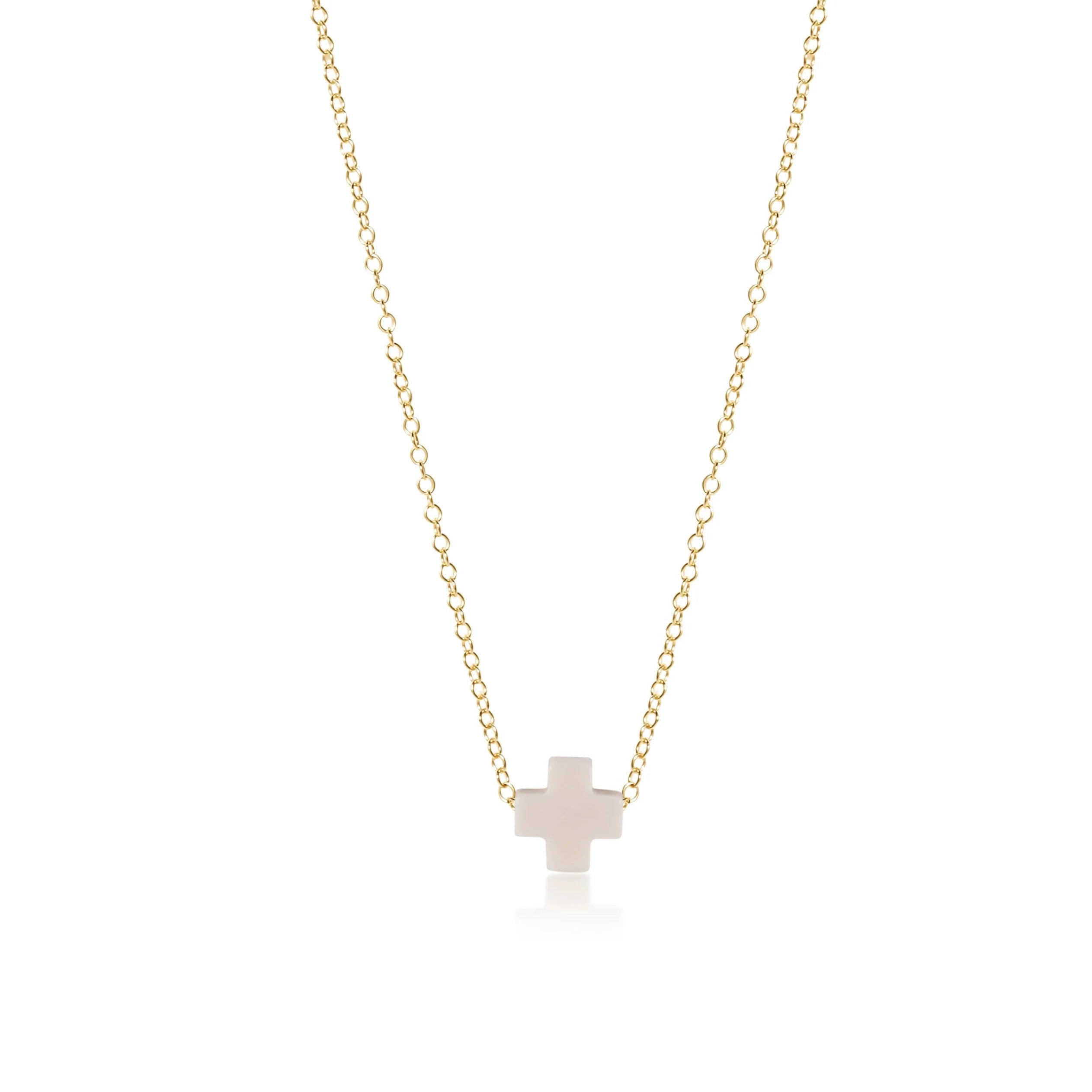 Cross necklace on a white background