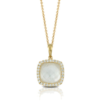 Gold necklace with a pendant featuring a large stone and smaller stones around it on a white background