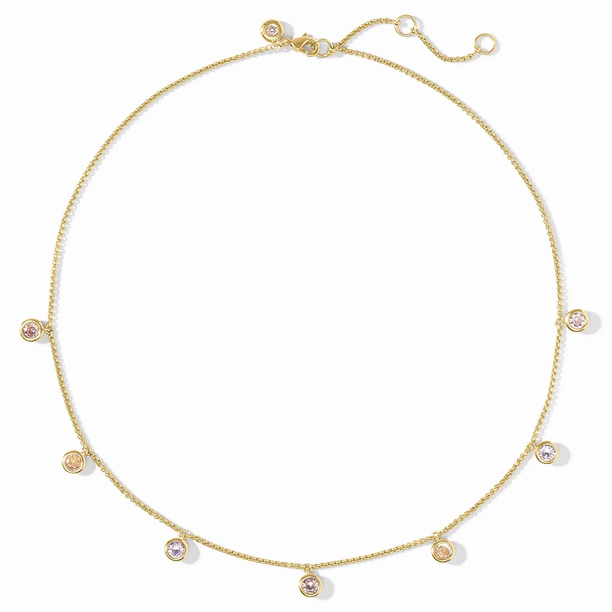 Gold necklace with small circular pendants on a white background