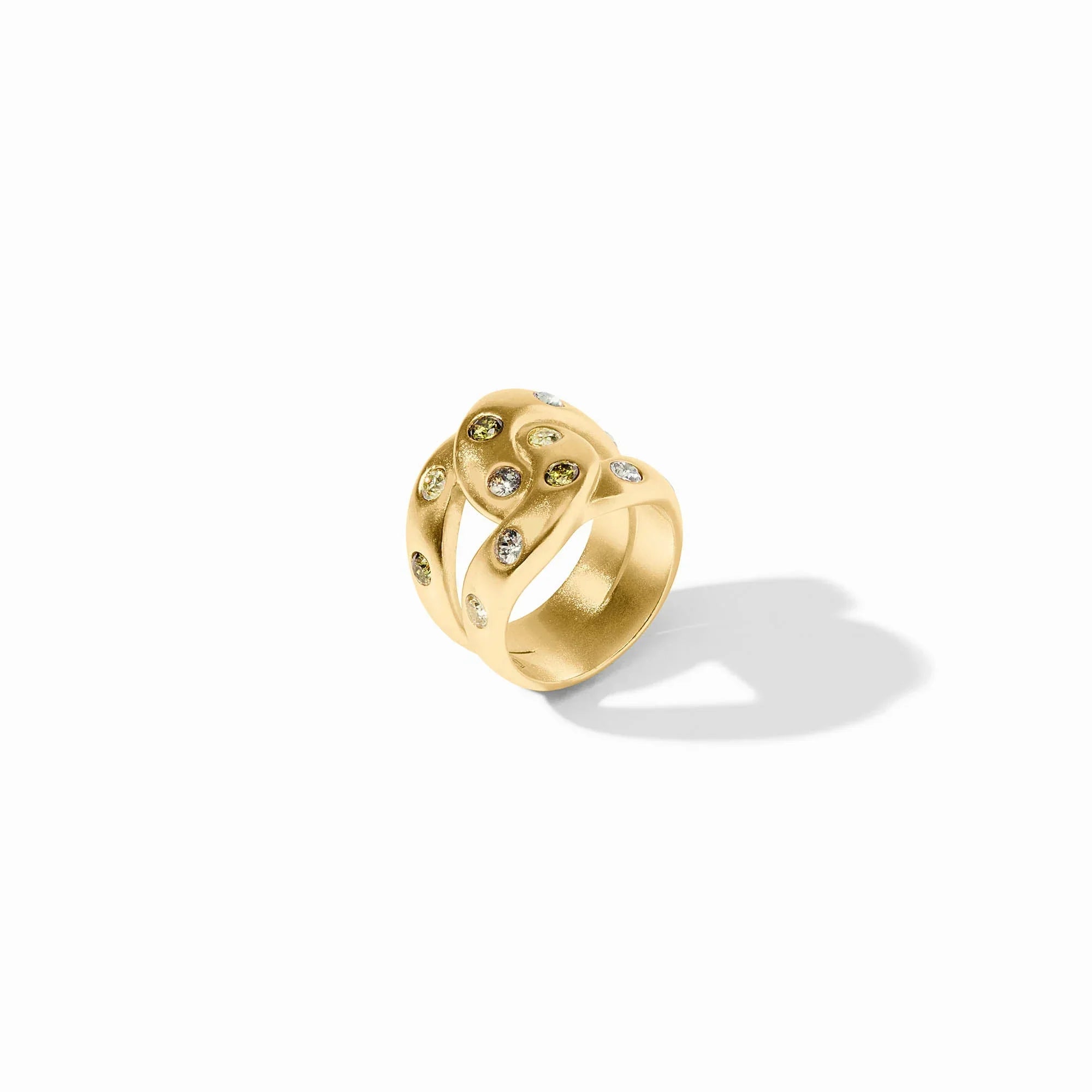 Gold ring with embedded stones on a white background