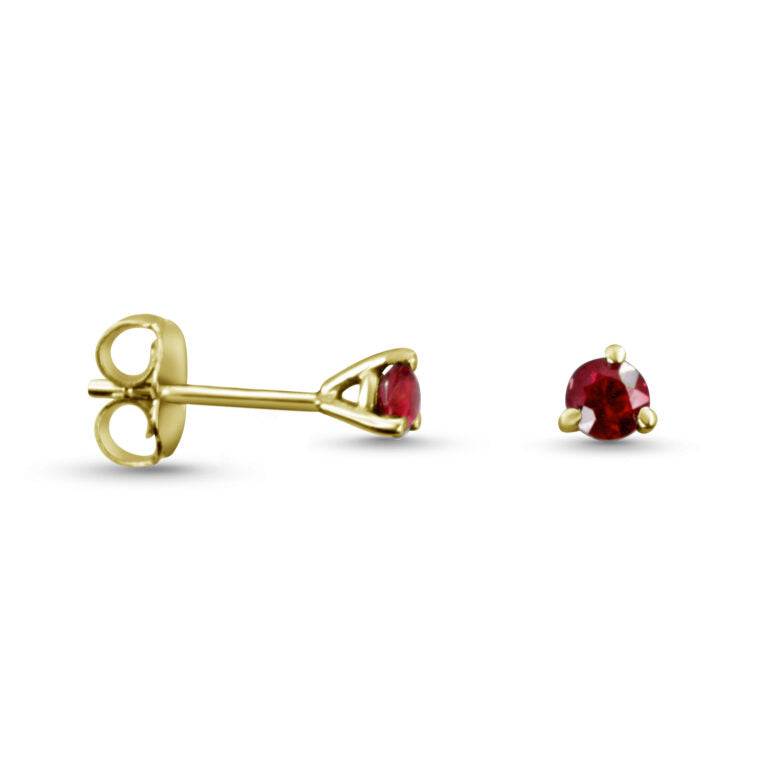 Gold earrings with red gemstones on a white background