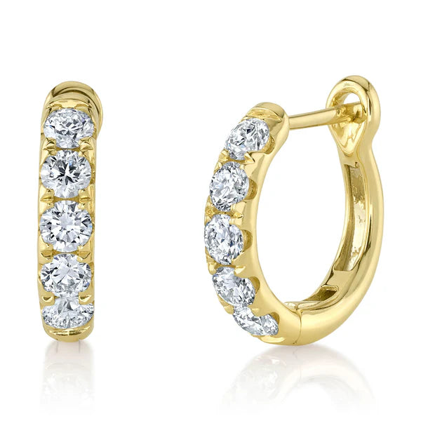Gold hoop earrings with diamond accents on a white background