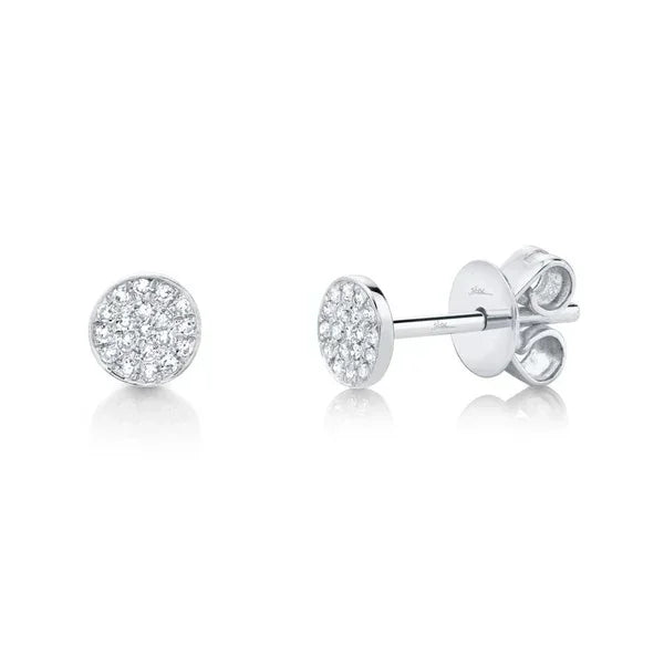 Silver earrings with clear gemstones on a white background