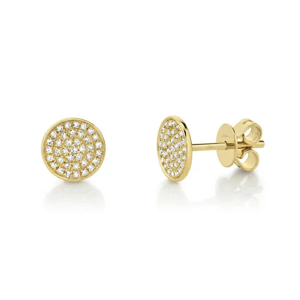 Gold earrings with diamond accents on a white background