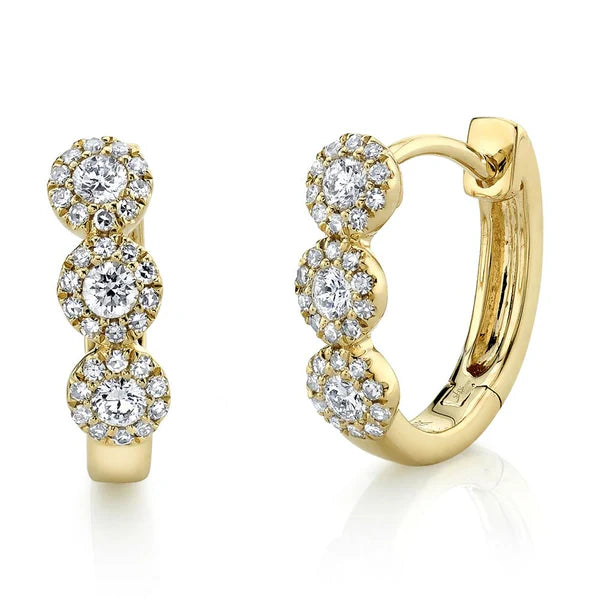 Gold hoop earrings with diamond accents on a white background