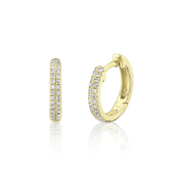 Gold hoop earrings with diamond accents on a white background