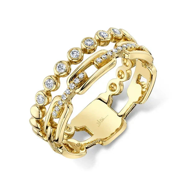 Gold ring with diamond accents on a white background