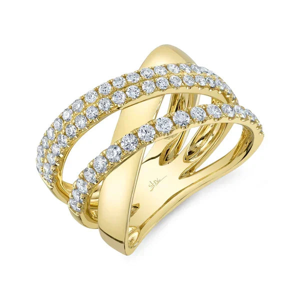 Gold ring with diamond accents on a white background