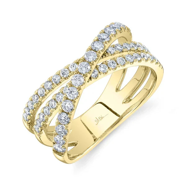 Gold ring with diamond accents on a white background