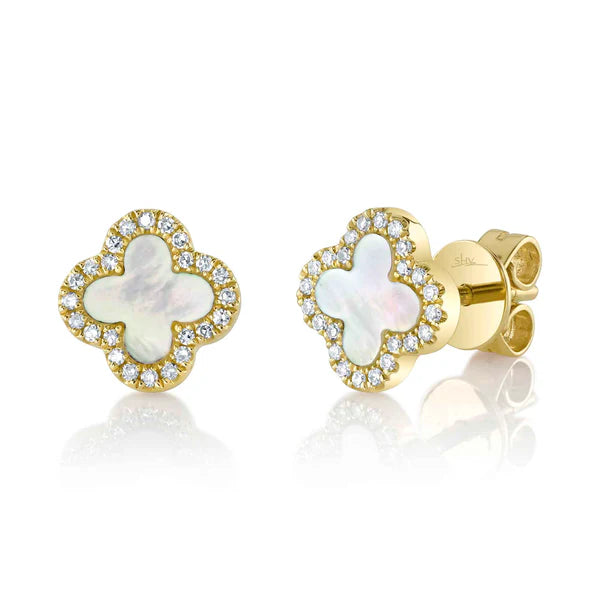 Gold earrings with butterfly design and clear stones on a white background