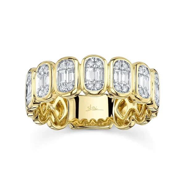 Gold ring with diamond accents on a white background