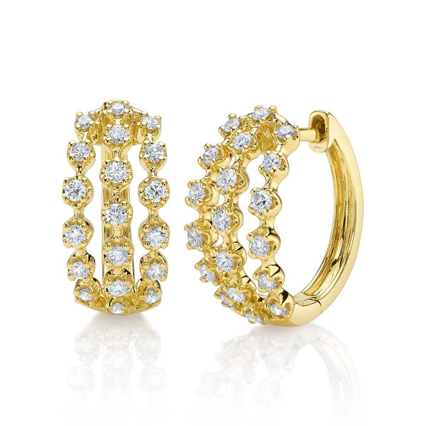 Gold hoop earrings with diamond accents on a white background