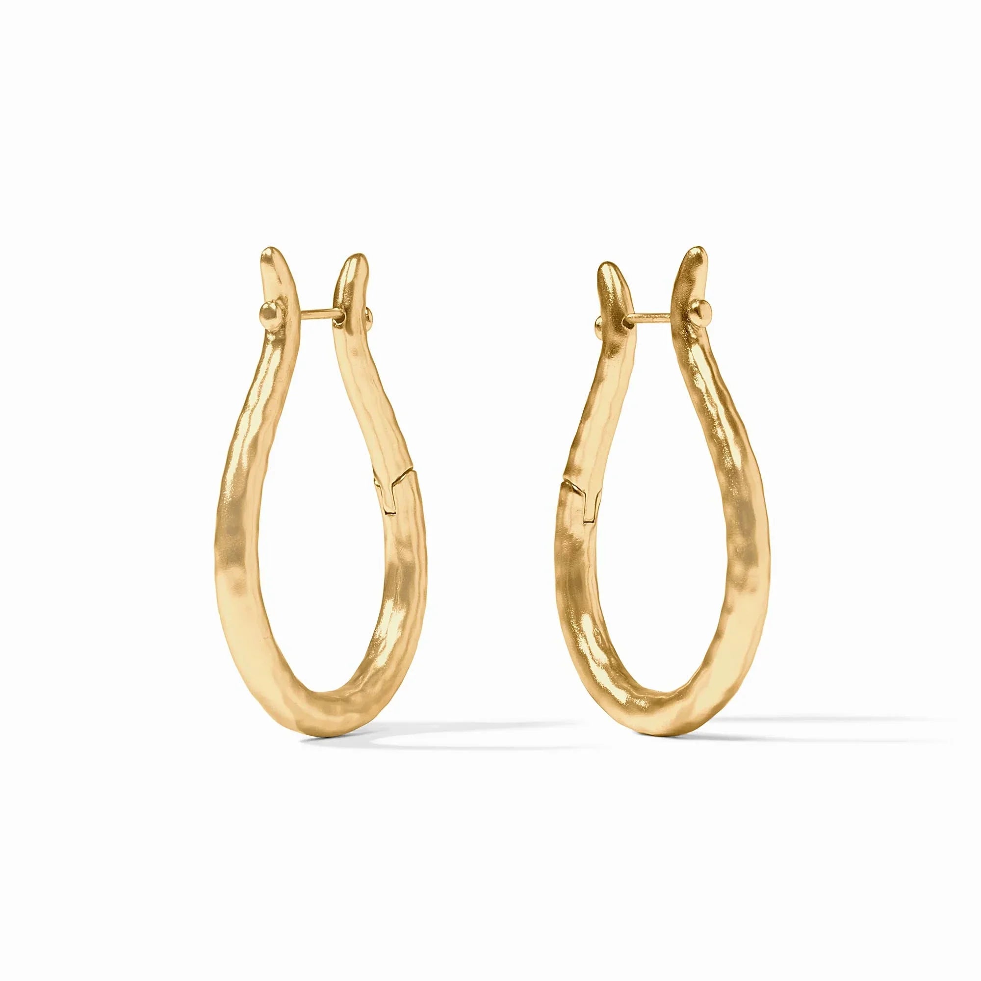 Gold hoop earrings on a white background