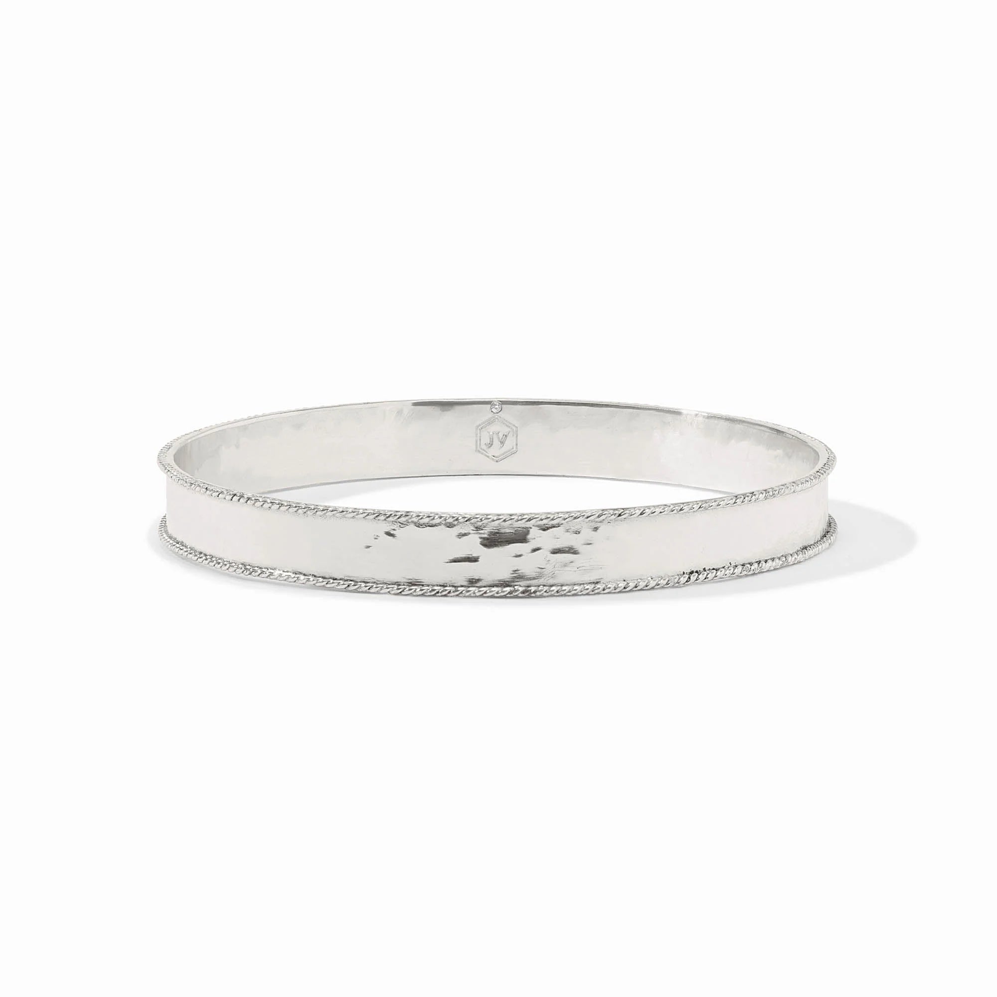 Silver bangle on a white background