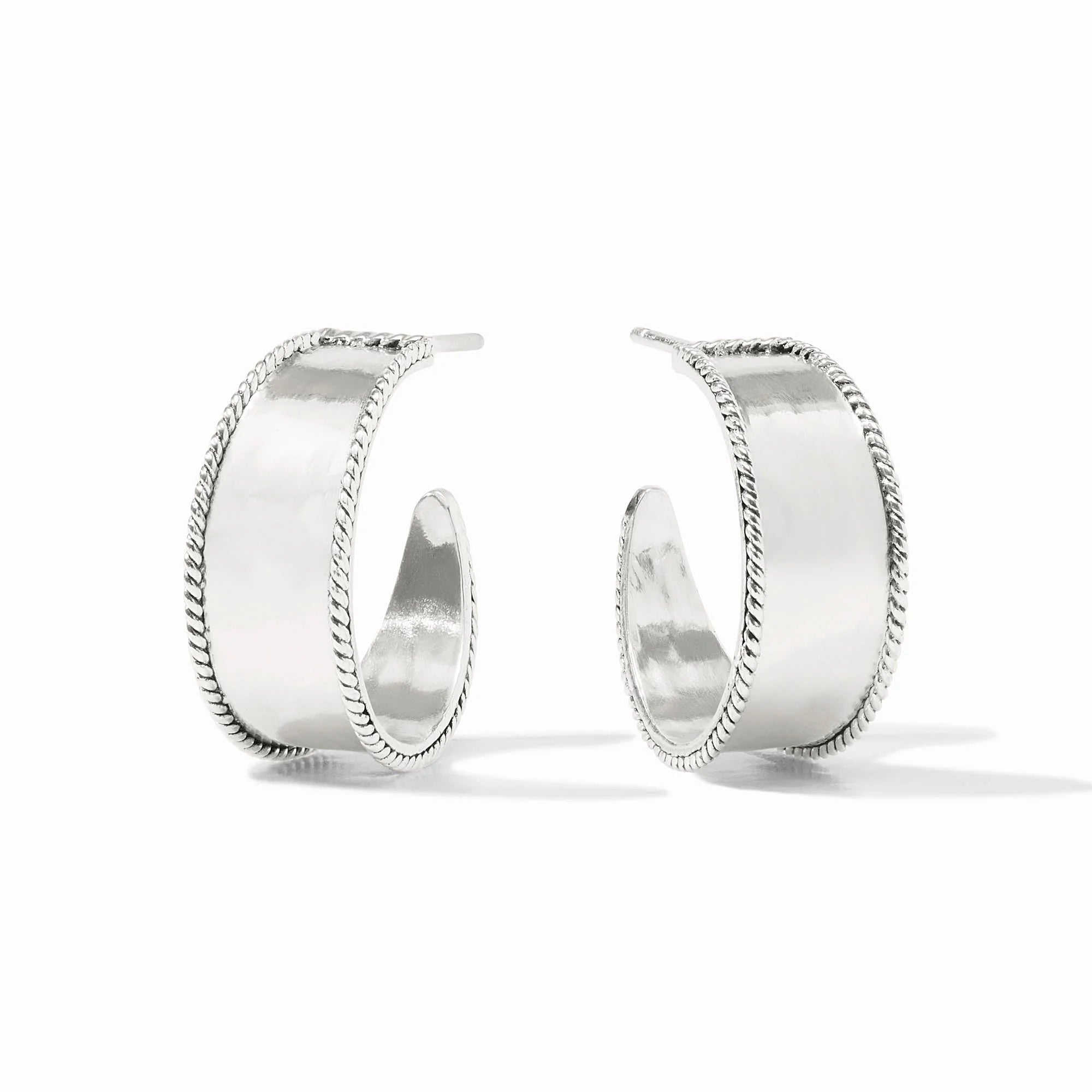 Pair of silver hoop earrings on a white background