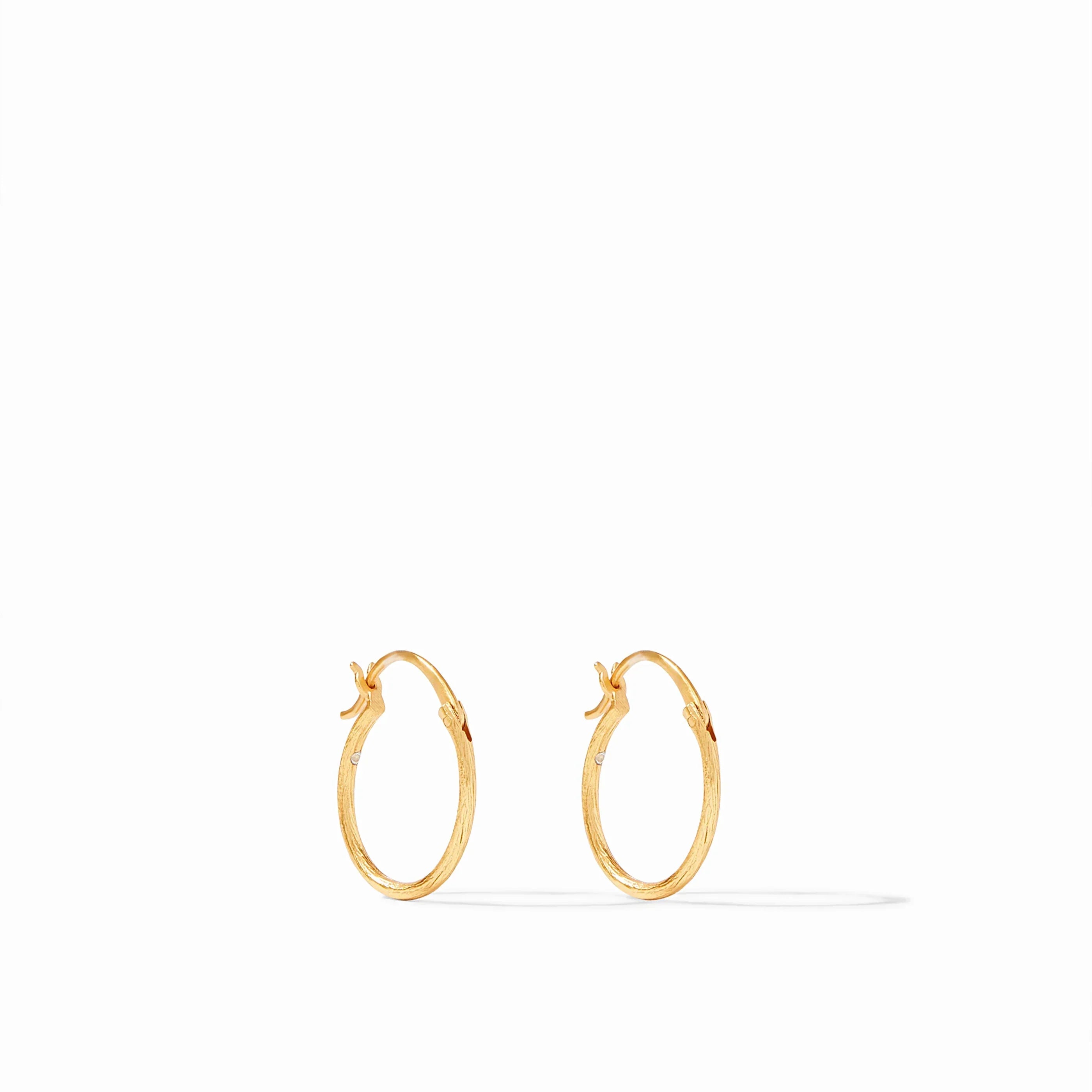 Gold hoop earrings on a white background