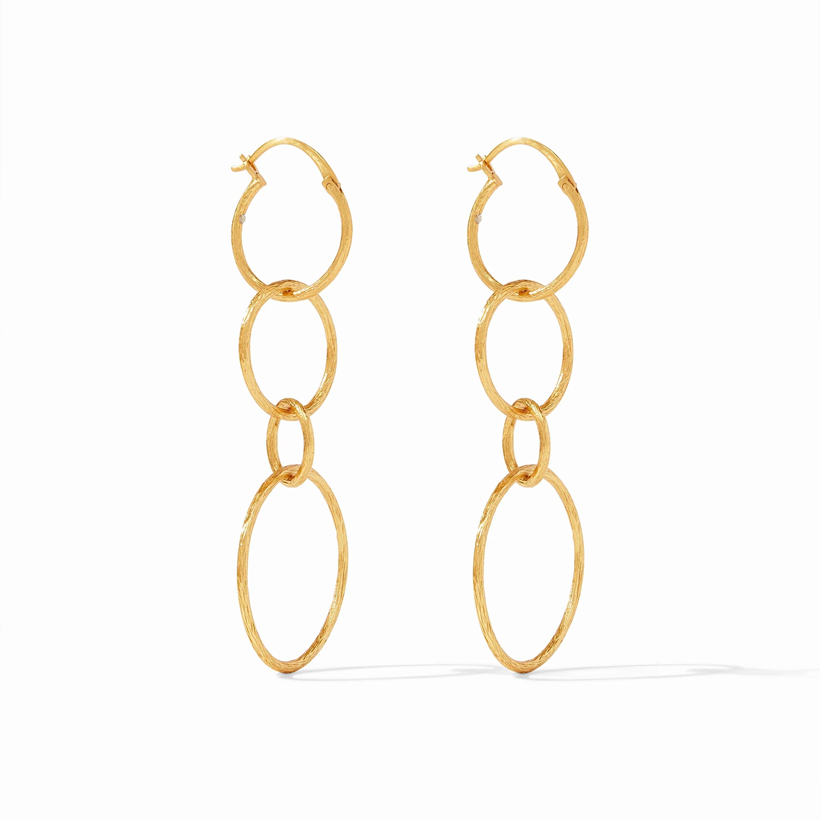 Gold chain earrings on a white background