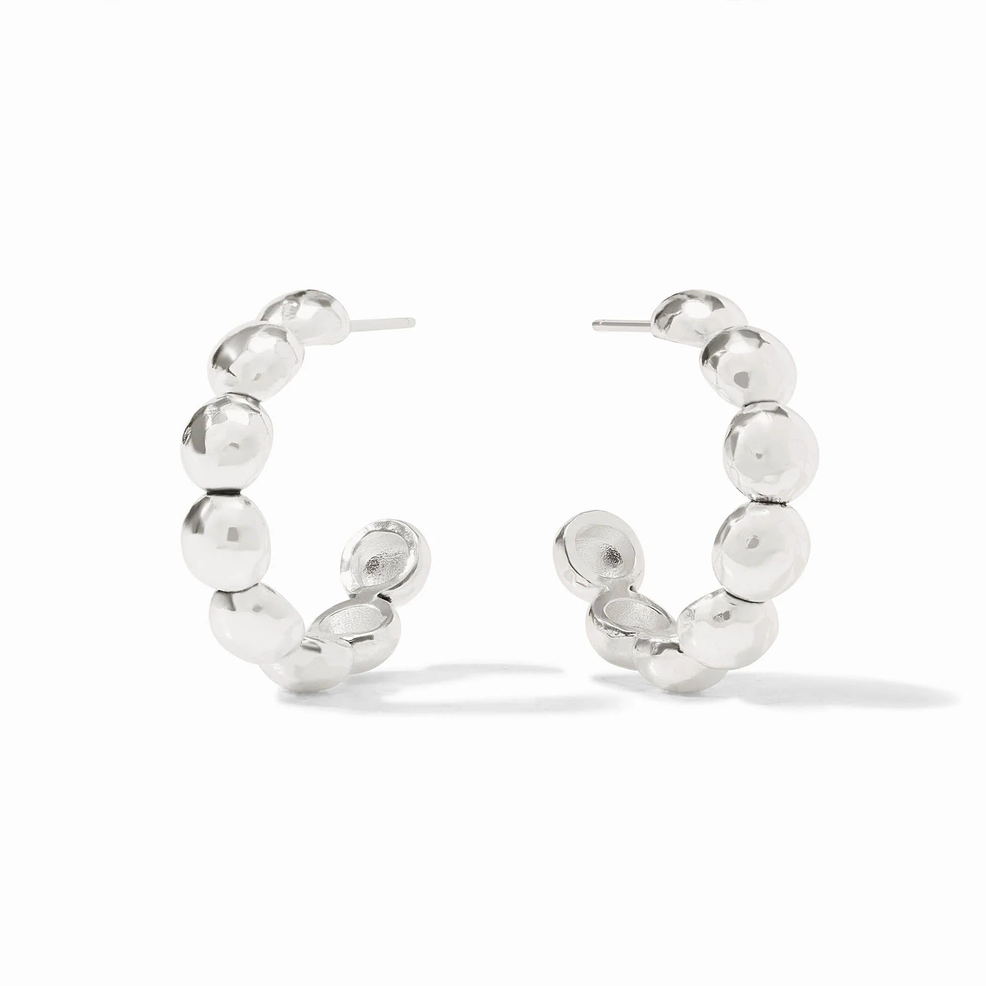 Silver hoop earrings with bead-like accents on a white background