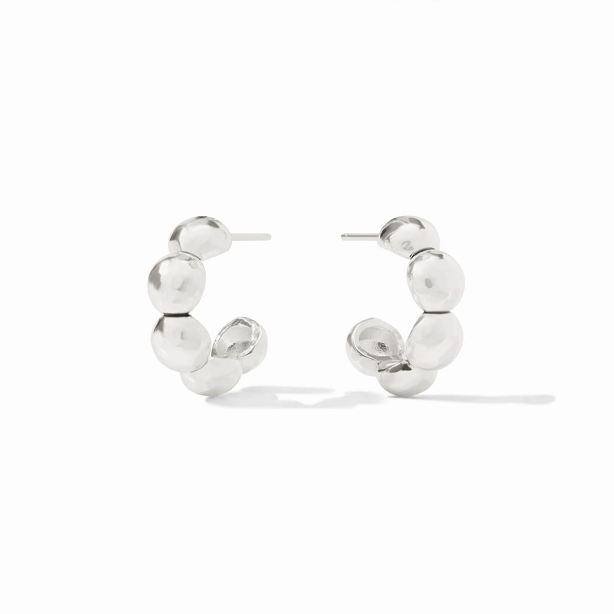 Silver hoop earrings with spherical beads on a white background