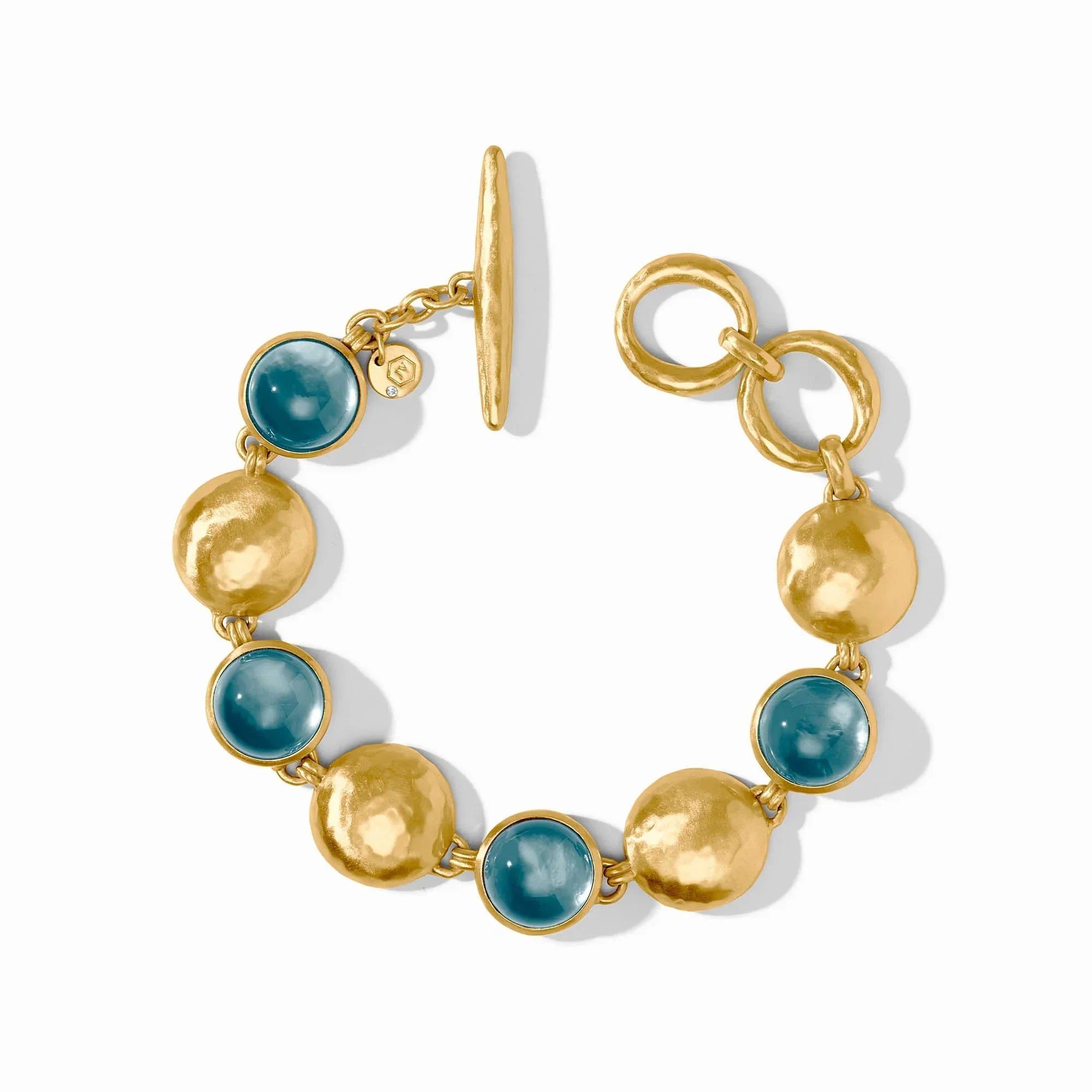 Gold and turquoise beaded earrings on a white background