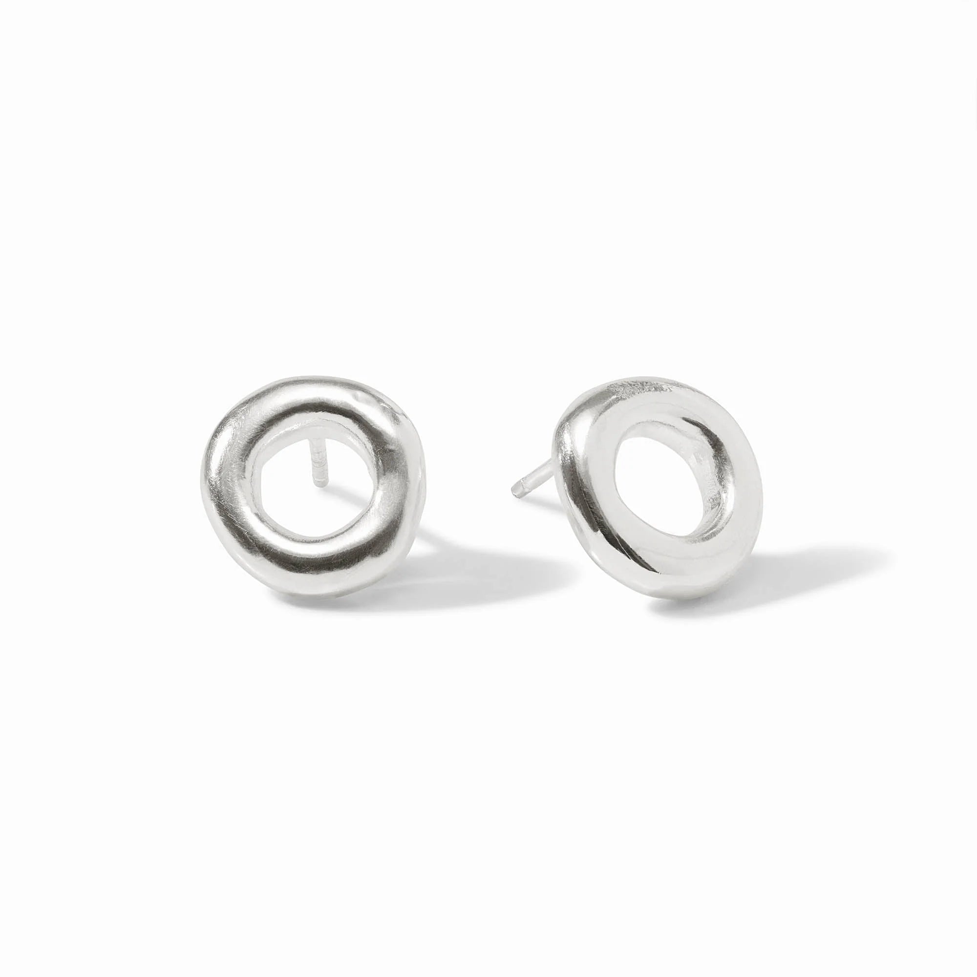 Pair of silver circular earrings on a white background