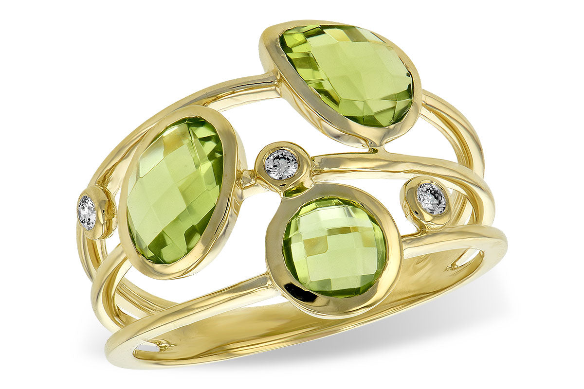 Gold ring with green gemstones and small diamonds on a white background