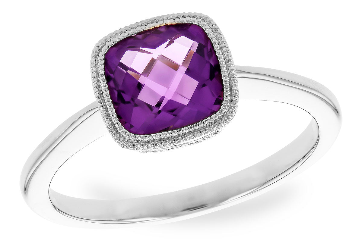 Silver ring with a purple gemstone on a white background