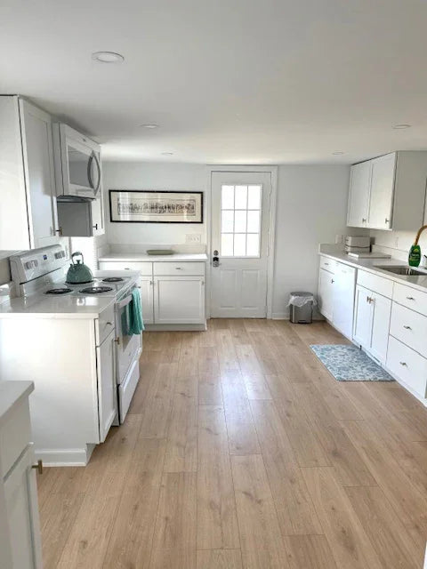 Modern coastal kitchen inside Water Street Casa vacation rental in Madison CT