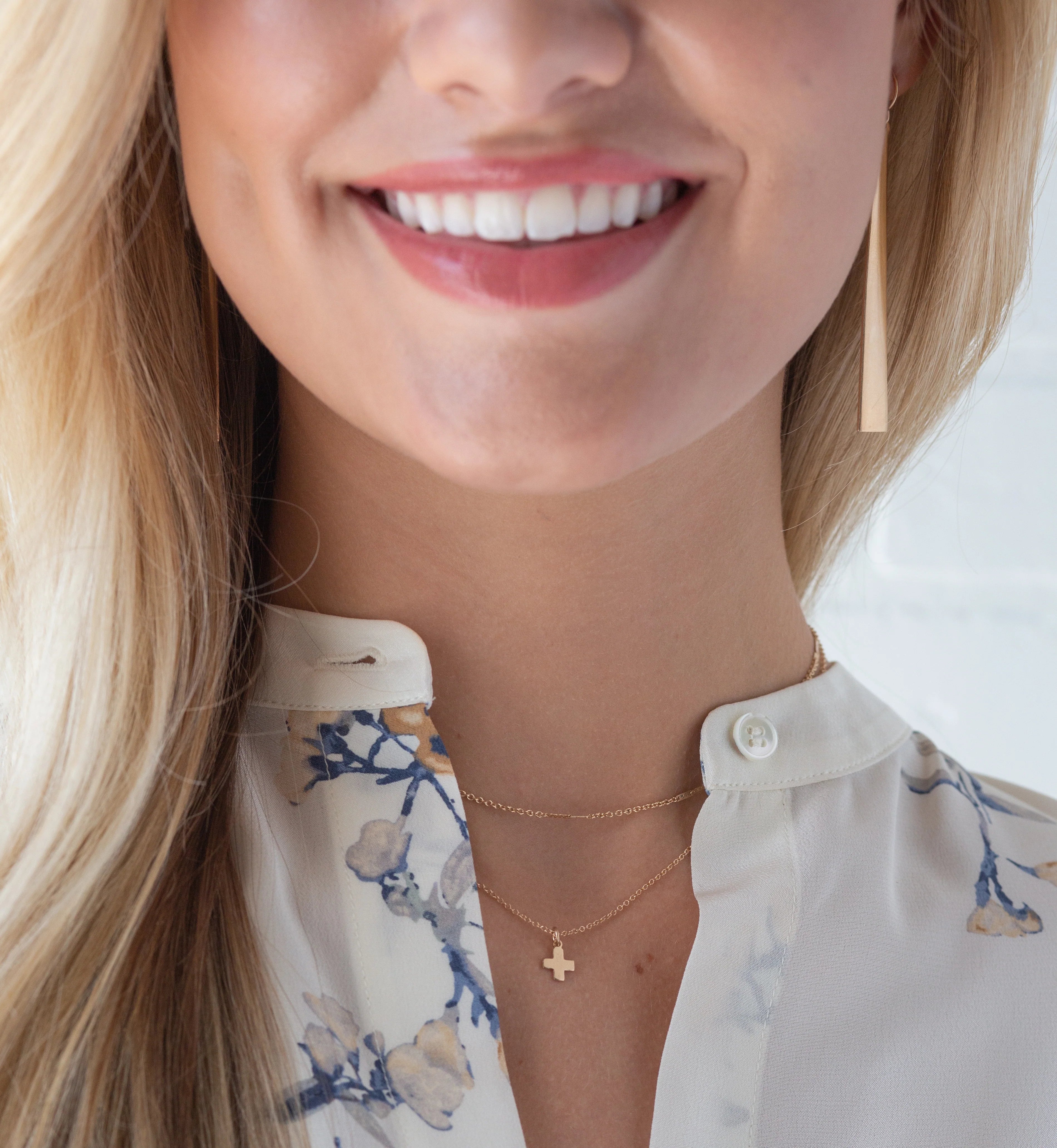 woman wearing a cross necklace